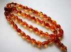 VINTAGE BALTIC AMBER COGNAC COLOR OVAL BEAD ISLAMIC ROSARY - 45 Beads