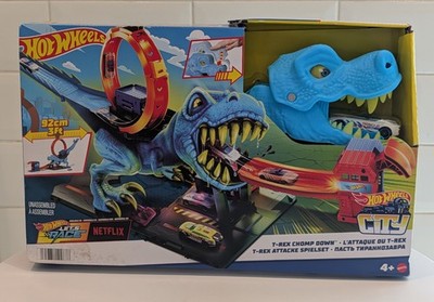 Hot Wheels City Rennbahn, T-Rex Chomp Down, Knock Down Dinosaurier mit Auto Stunt