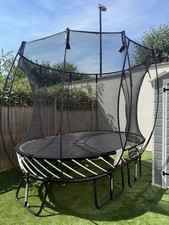 Springfree Spring Powered Trampoline with Safety Enclosure Net. roughly 6 x 8ft