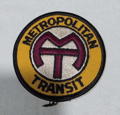 This vintage Chicago Transit Authority (CTA) ''Metropolitan Transit'' logo uniform