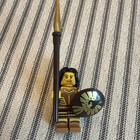 LEGO Minifigure w/ Spear & Round Shield, Brown Armor Outfit, Black Hair — photo 4