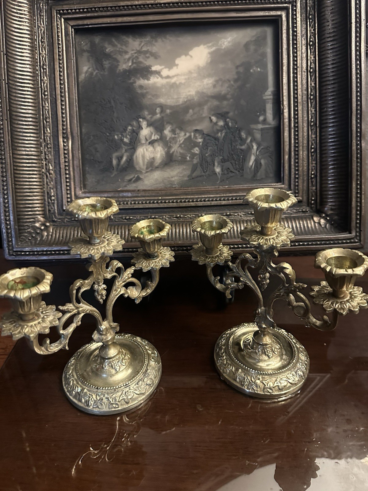 Antique French brass church candelabra with tiered candle arms and aged patina