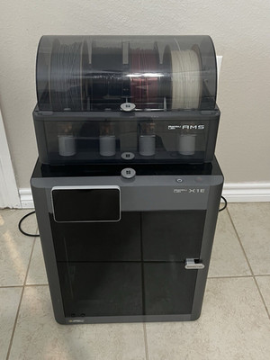 Bambu Lab X1E FDM 3D Printer w/ AMS, Wi Fi Touchscreen, 256mm, 500mm/s 300 hours
