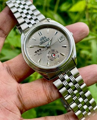 Orient Automatic Men's Watch Champagne Sunburst Dial Pointer Day Ref. EM5J-C0
