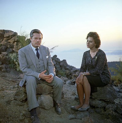 Marcello Mastroianni and Sophia Loren sitting on the rocks in Marr- Old Photo