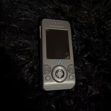 Used Vintage Sony Ericsson W580i slider-style mobile phone. Untested