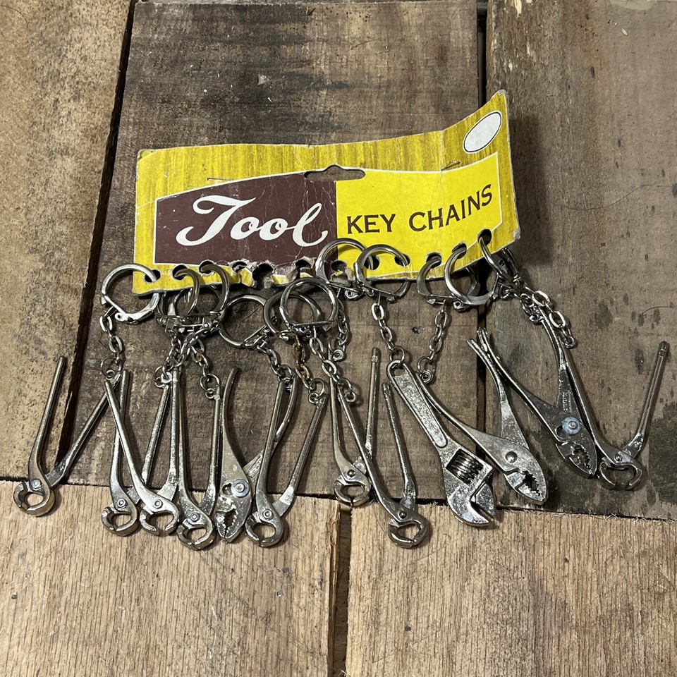 A full vintage display rack of 12 mini adjustable wrench keychains — a novelty store-ready relic that's quirky and giftable as a set.