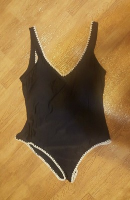 black bathing suit with white trim