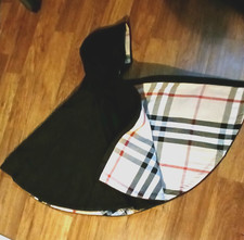 Toddler black cape with brown plaid lining. Perfect for formal and winter wear.