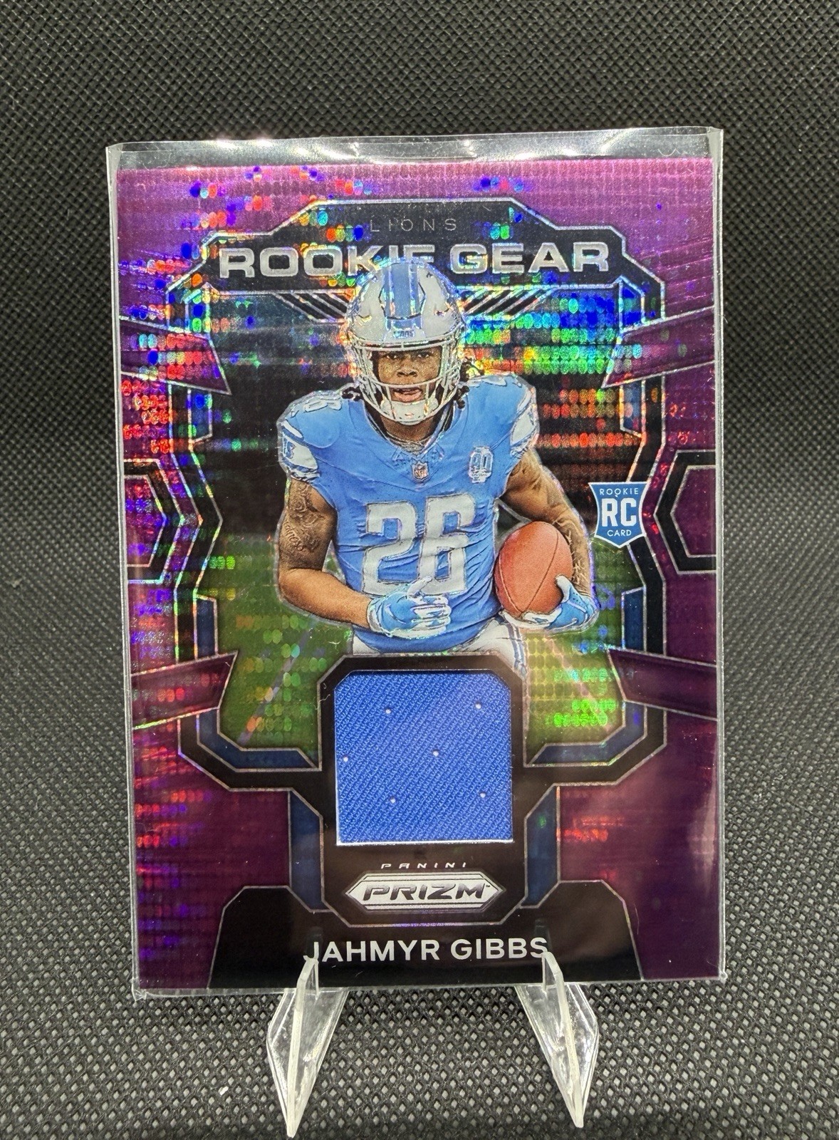 2023 Panini Prizm - Rookie Gear Jahmyr Gibbs #RG-JG Purple Pulsar Prizm (MEM,...