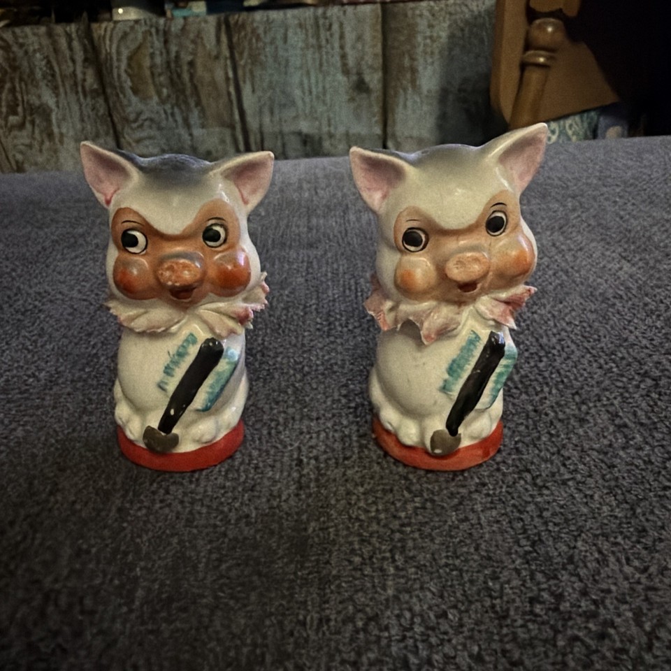 Kitschy mid-century Japanese anthropomorphic pig shakers with that perfect "where did you find this?" energy.
