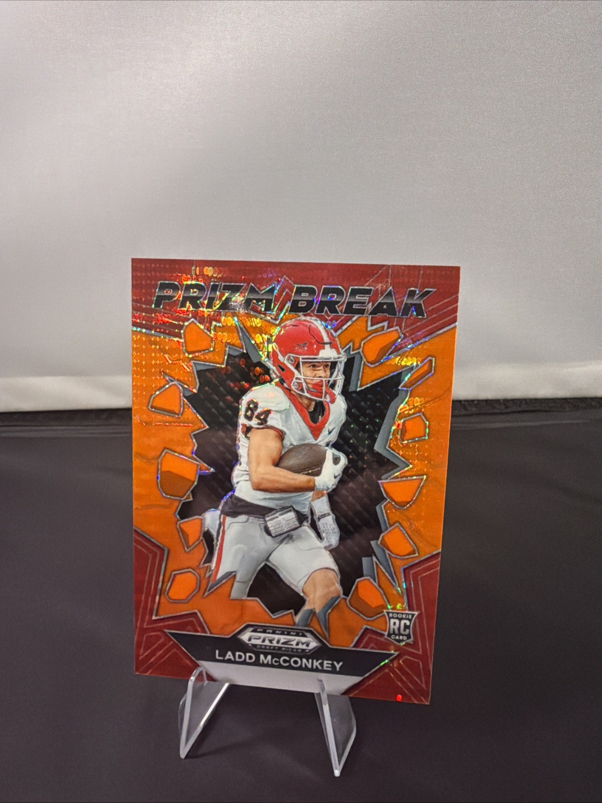 2024 Panini Prizm Draft Picks Ladd McConkey Prizm Break Orange Pulsar #/49