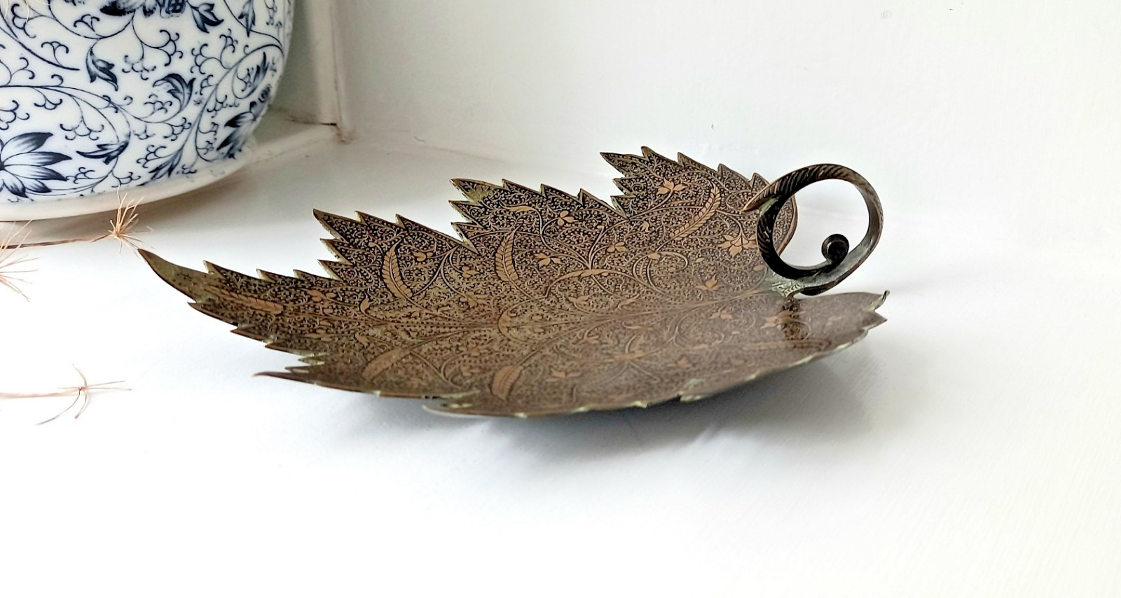 Antique Kashmiri brass sweetmeat dish in the shape of a Chinar leaf, scroll hand