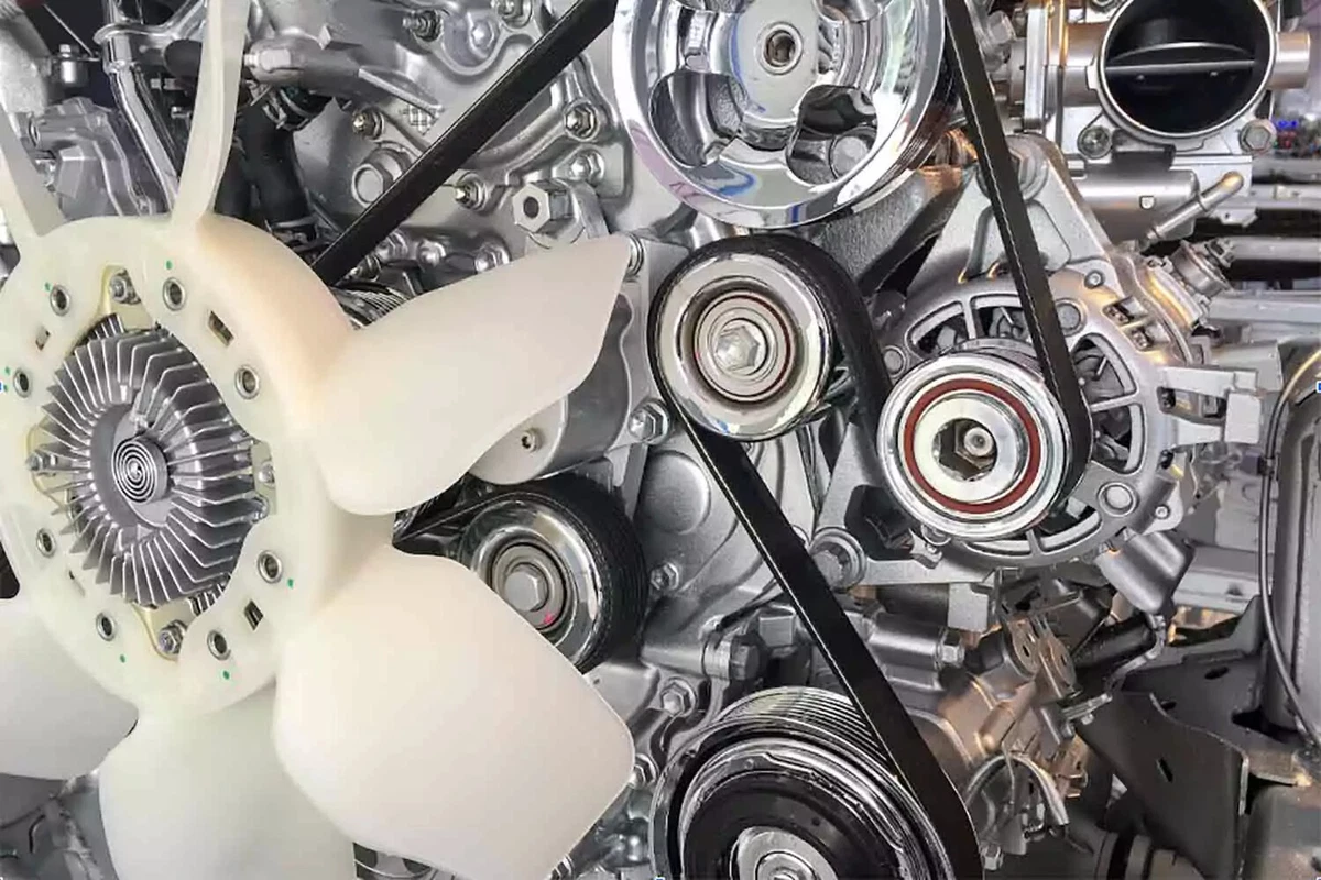 A spotless engine equipped with a brand new serpentine belt.