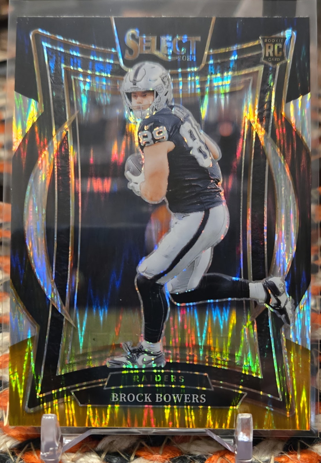 2024 Panini Select #31 Brock Bowers (RC) Concourse Black and Gold Shock Prizm