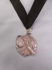 winged shoe silver medal track with black neck ribbon trophy award