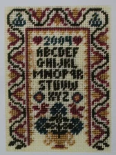 The Purple Tulip Sampler - Threads Through Time