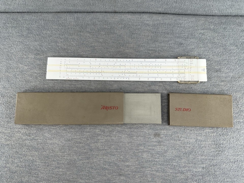 A West German Aristo Studio 968 slide rule in its original box — a beautifully made precision instrument from the Cold War era that feels like a prop from a spy thriller.