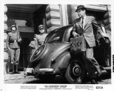 William Holden getting out of a car holding a leather briefcase in- Old Photo