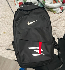 Nike Lightweight Black Backpack White Swoosh Logo Red Accents Zip Closure