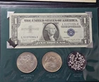 THE SILVER STORY SET. Two Silver Dollars, Silver Certificate And 999 Shot!