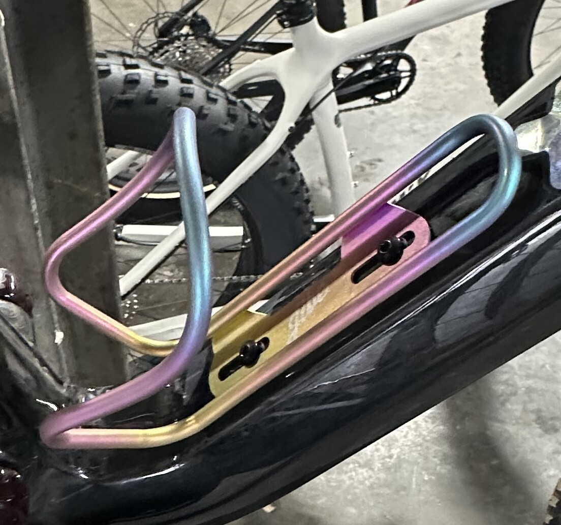 JIbe Titanium water bottle cage in gold anodized matte finish