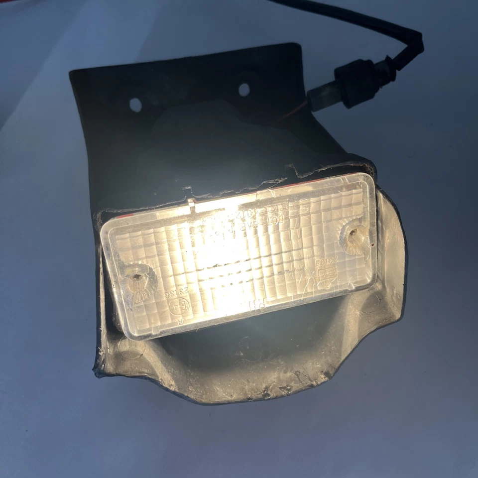 Lámpara de luz de reversa parachoques trasero para camioneta Nissan Datsun 720 1980-85 OEM IKI OE Foto 3 de 4
