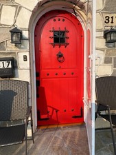 Rustic solid alder lumber arched top pre hung 2 sets trim customer painted red