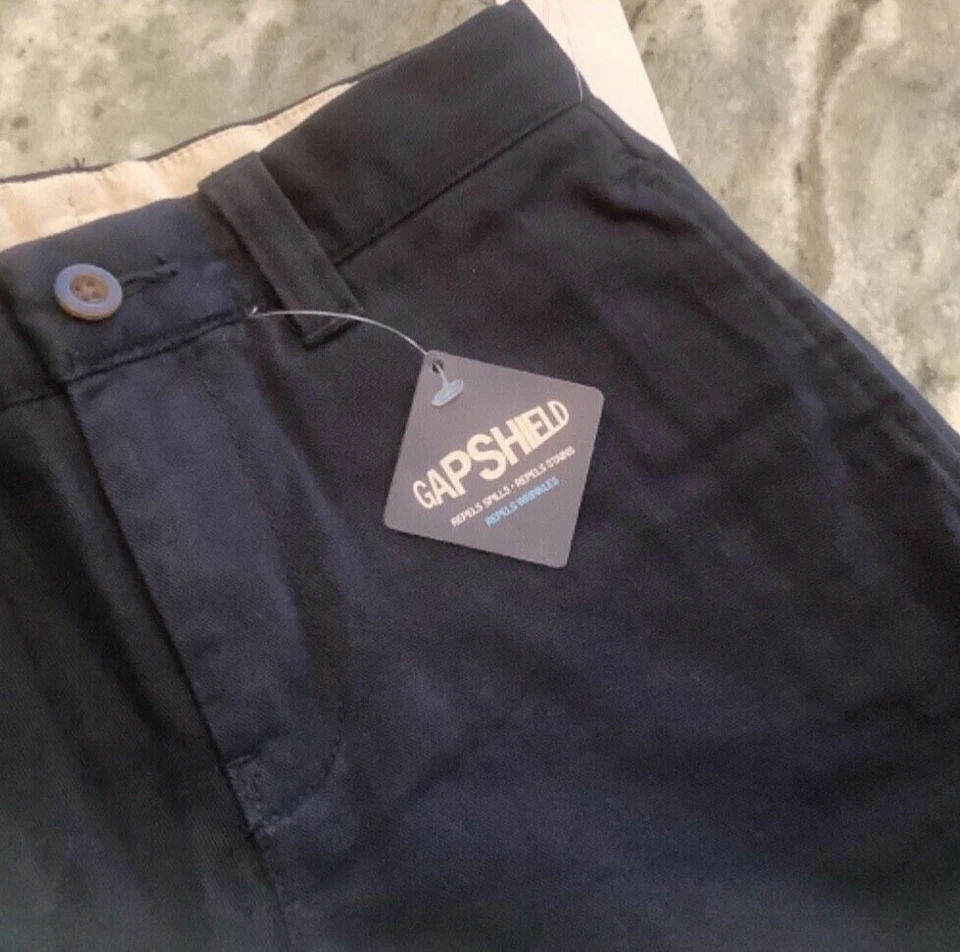 Calça uniforme frente plana azul cáqui infantil Gap nova com etiquetas tamanho 7 NOVA. Cintura ajustável - Imagem 4 de 4