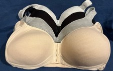 NIP Set of 4 Bras, front closure, size large. Light grey, black, med. grey, tan.