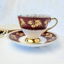 Gladstone teacup and saucer Deep burgundy Gold Ivy England 
