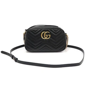 Sac bandoulière Gucci noir matelassé chevron doré GG Marmont petite chaîne