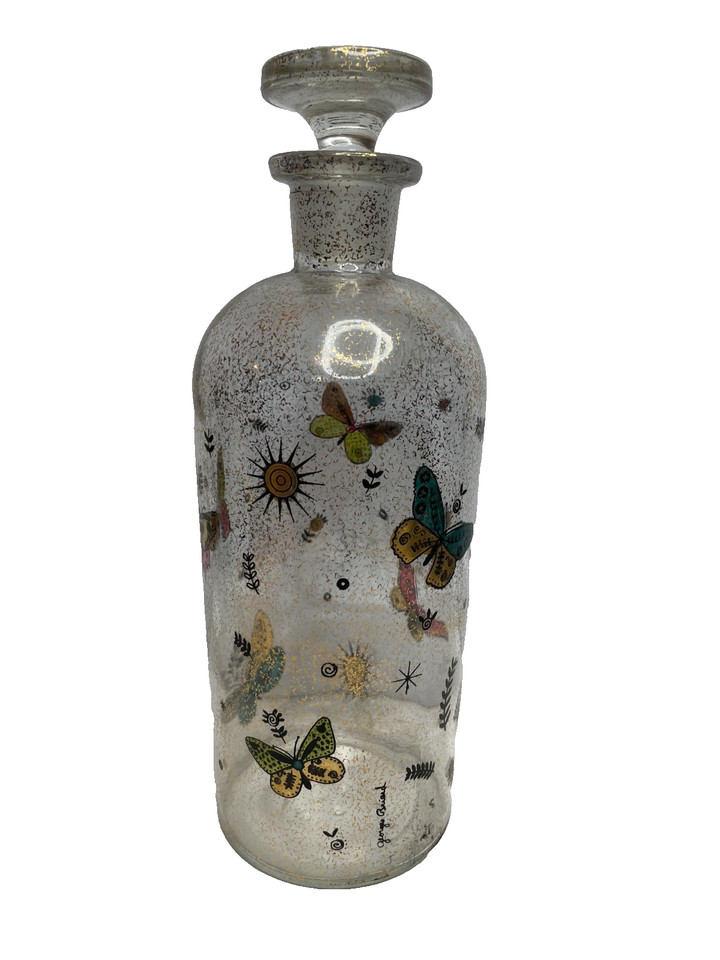 A Georges Briard gold foil butterfly decanter — mid-century modern barware from a designer whose work belongs in a museum as much as on a bar cart.