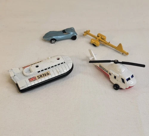 Vintage Matchbox/Tootsie Toy Lot of (4) Hovercraft/ Helicopter/Hitch/Hot Rod