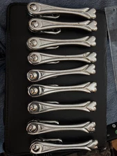 9 Antique Art Deco (Nouveau?) stair (carpet) clips ( marked Alexander)