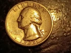 1934 silver Washington quarter in VF condition.