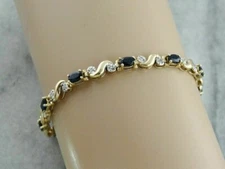 5 CT Oval Cut Sapphire & Diamond S Link Tennis Bracelet 14K Yellow Gold Finish