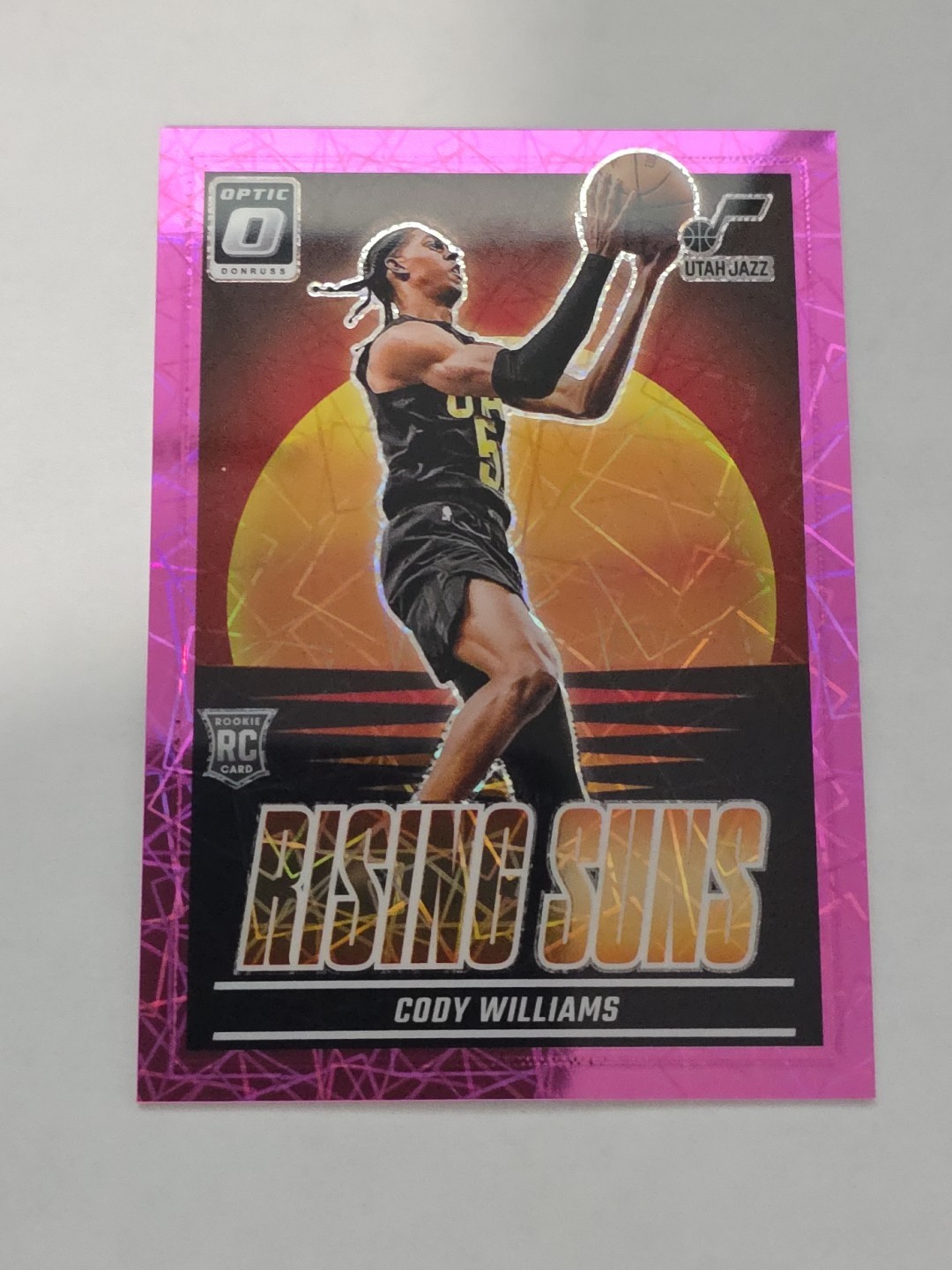 2024-25 Donruss Optic Cody Williams #8 RC Rising Suns Pink Velocity #/79
