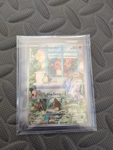 Charmander POKÉMON card full art face in the window