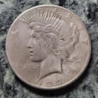 1927 LIBERTYPEACE SILVER DOLLAR. Actual coin shown in pictures.