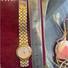 Men  s Bulova watch water, resistant stainless steel back band two-tone Au/Ag