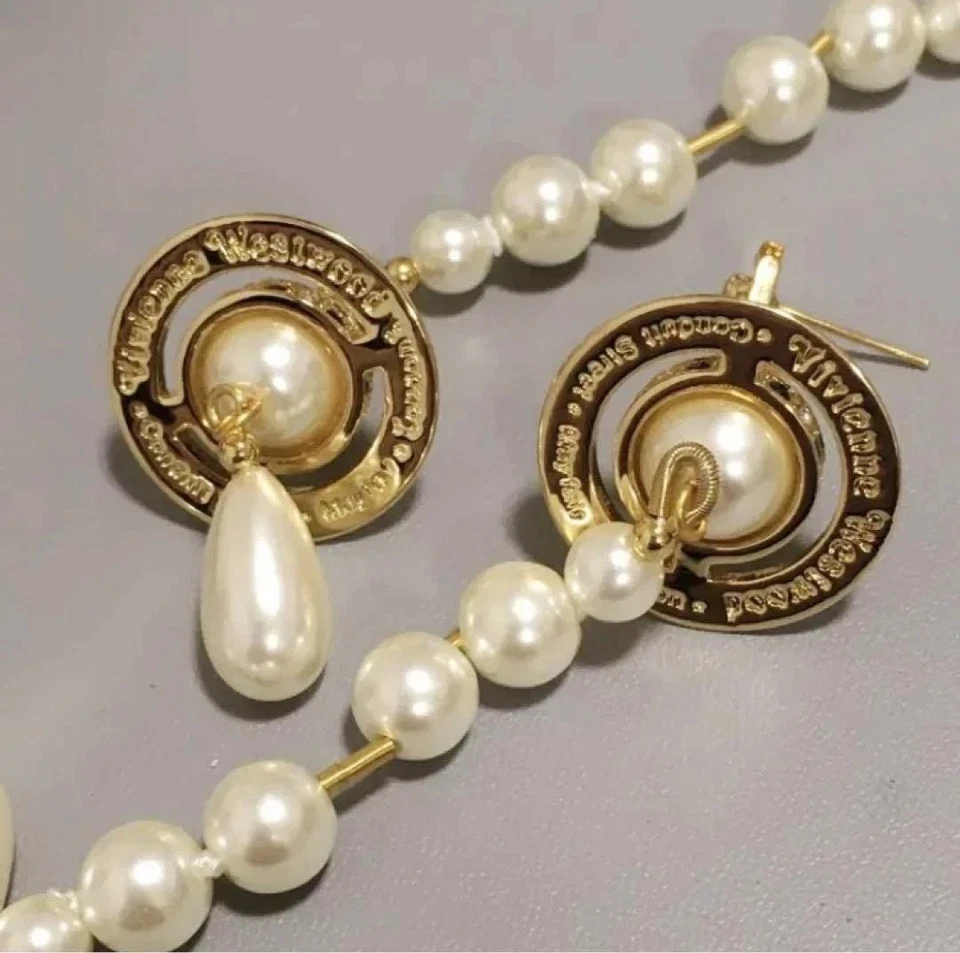 Pendientes colgantes Vivienne Westwood oro orbe 3D perlas largas usados sin defectos Foto 2 de 3