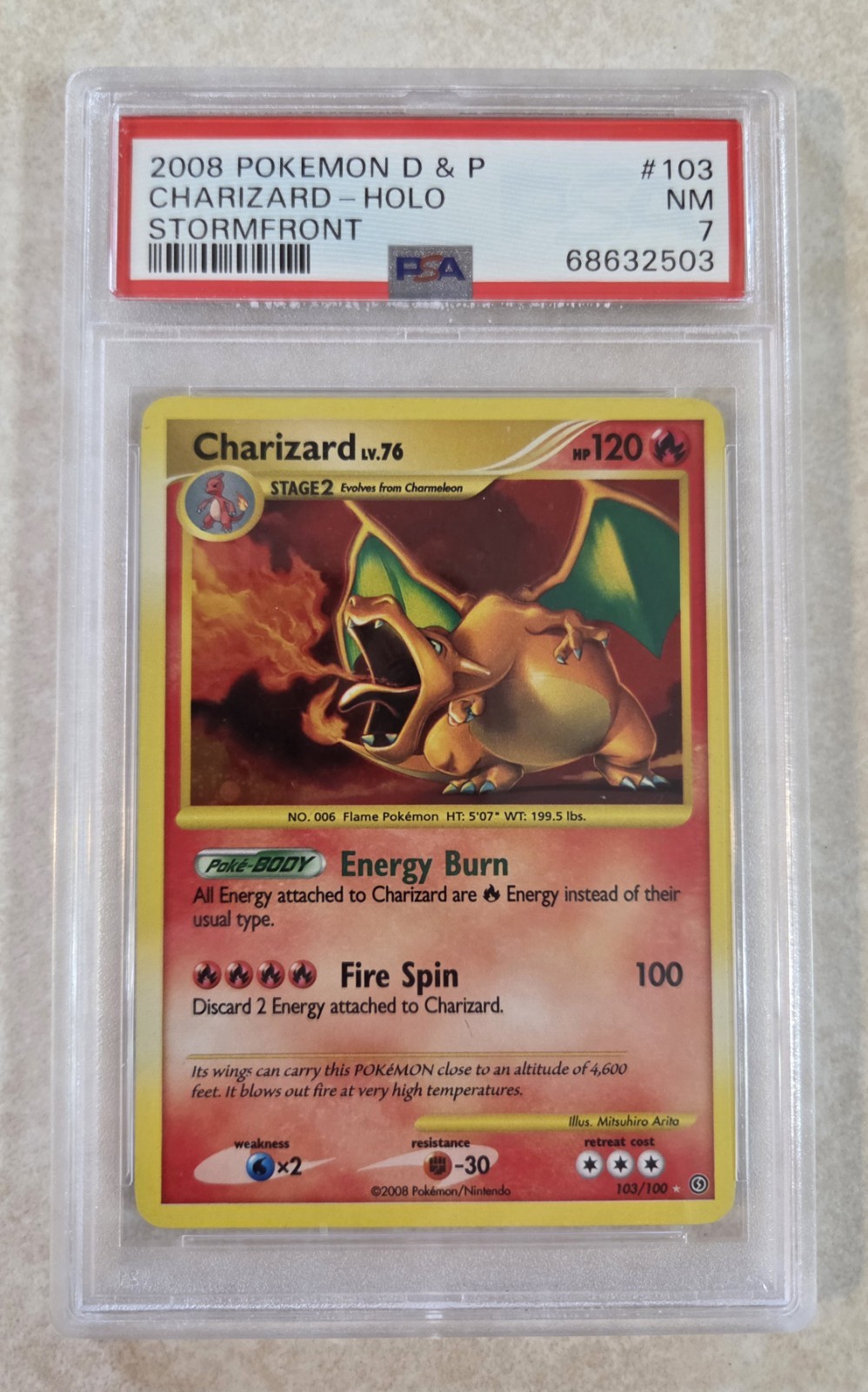 PSA 7 Diamond & Pearl Stormfront Charizard #103/100 Secret Rare