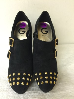 guess black boots gold buckle