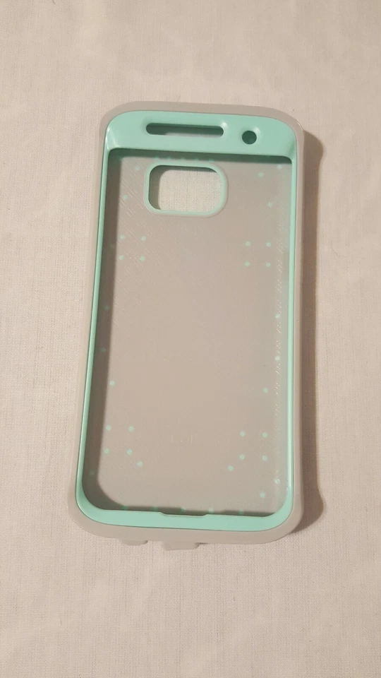FUNDA TELÉFONO ELV (evolve Live Venture) SAMSUNG GALAXY S7 EDGE (COMO NUEVA/GRIS). Foto 2 de 3