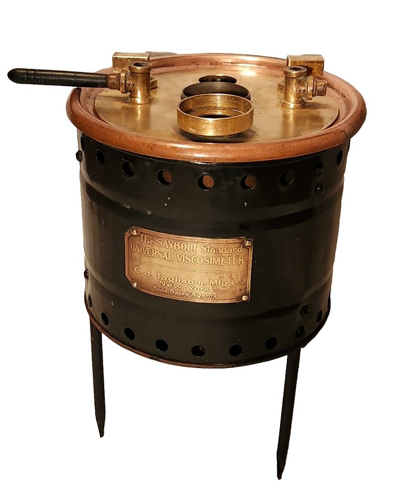 A 1914 brass oil viscosimeter that looks like a mad scientist's dream — functional industrial science meets steampunk sculpture.