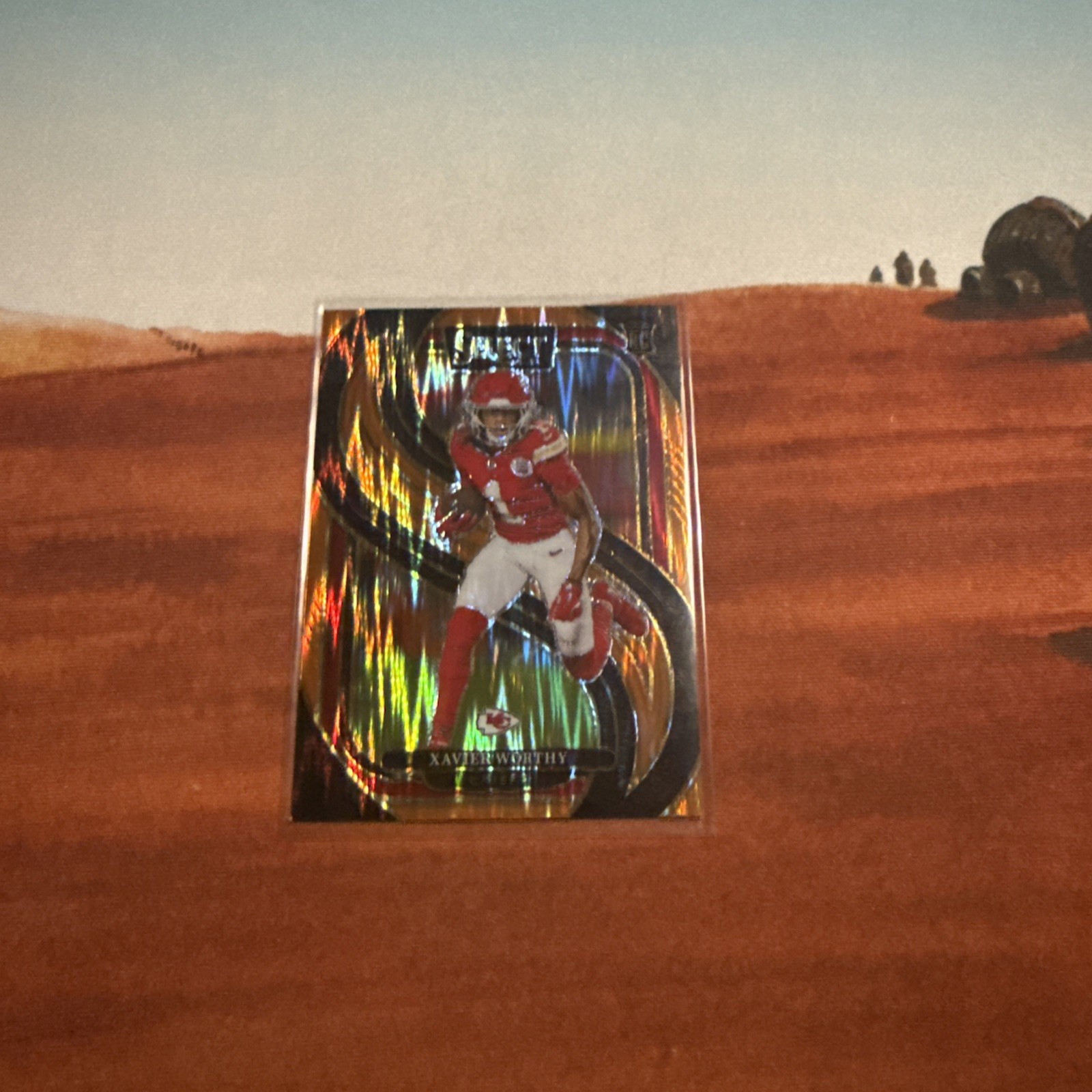 2024 Panini Select - Premier Level Xavier Worthy #119 Orange Prizm /399 (RC)