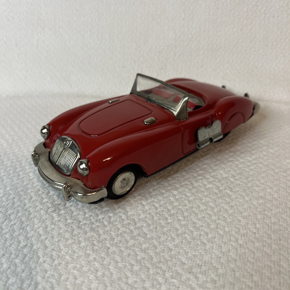 Lot - Bandai, Japan: A Tin Plate Friction Powered Red MGA-1600 Coupe