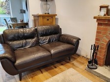 Brown leather sofa  very comfy and excellent condition with footstool storage