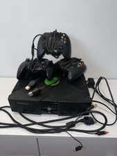 Xbox console with 3 controllers